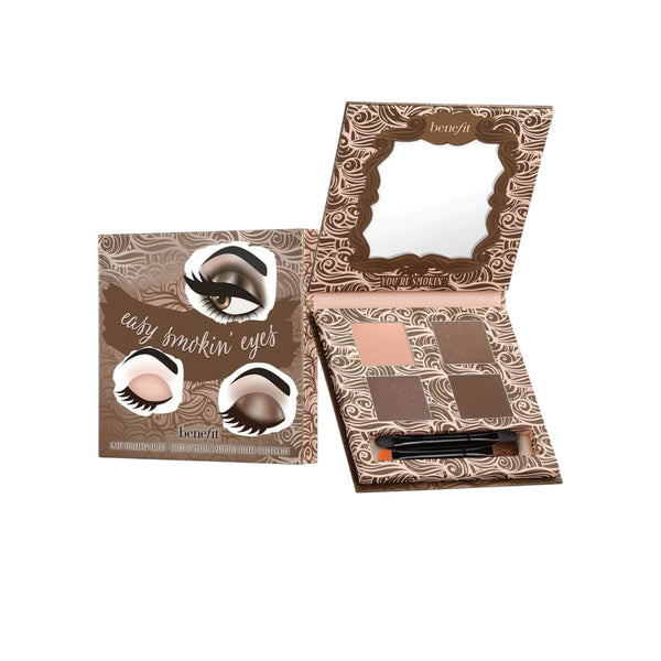 Benefit eyeshadow palette with mirror and applicators on a white background