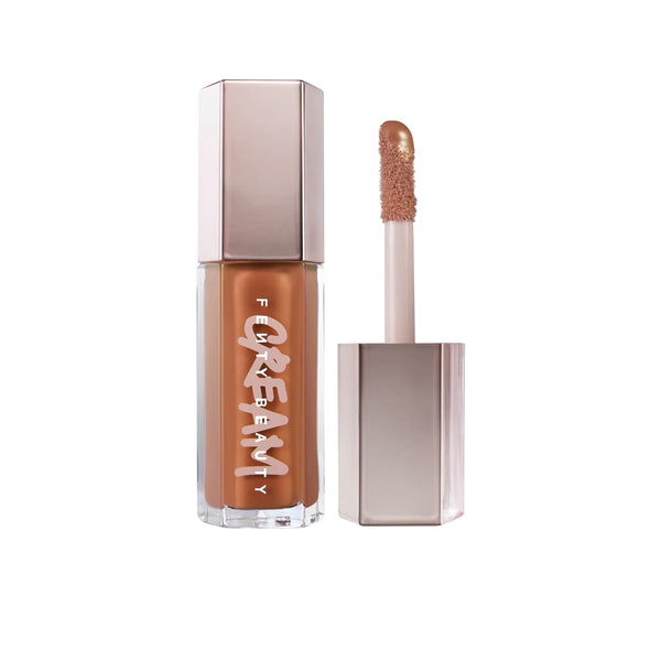 Lip gloss with applicator on a white background