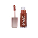 Lip gloss with applicator on a white background