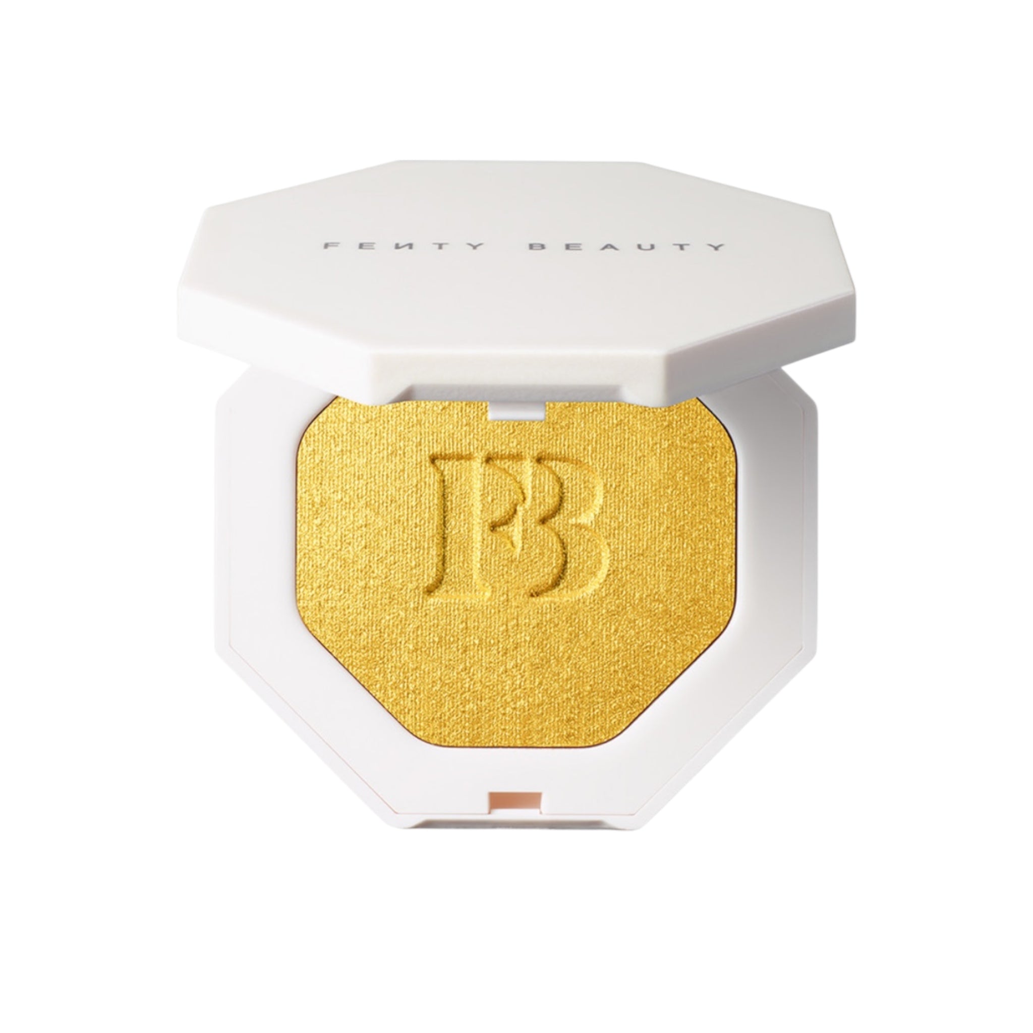 Fenty Beauty product with gold shade and white packaging on a white background