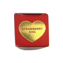 Red box with a gold heart-shaped label reading 'Strawberry Kiss' on a white background