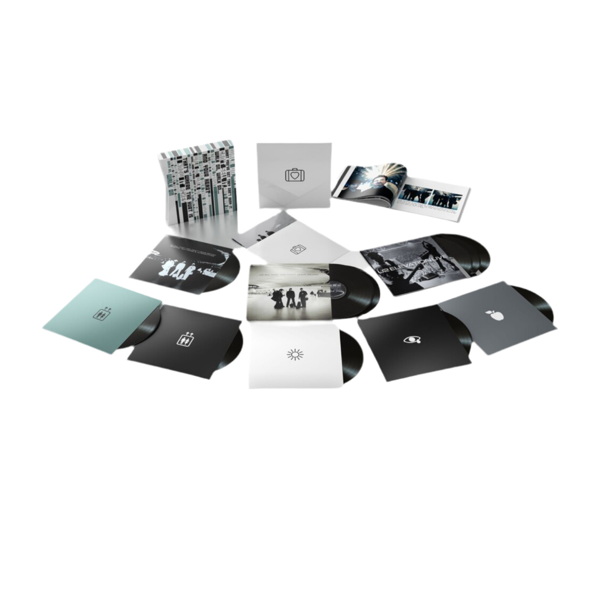 Collection of vinyl records and packaging on a white background